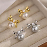 Sterling Silver Elegant Pearl And Bow Stud Earrings