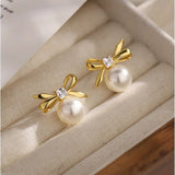 Sterling Silver Elegant Pearl And Bow Stud Earrings