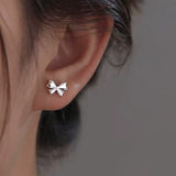 Sterling Silver Niche Design Bow Stud Earrings