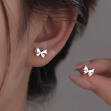 Sterling Silver Niche Design Bow Stud Earrings